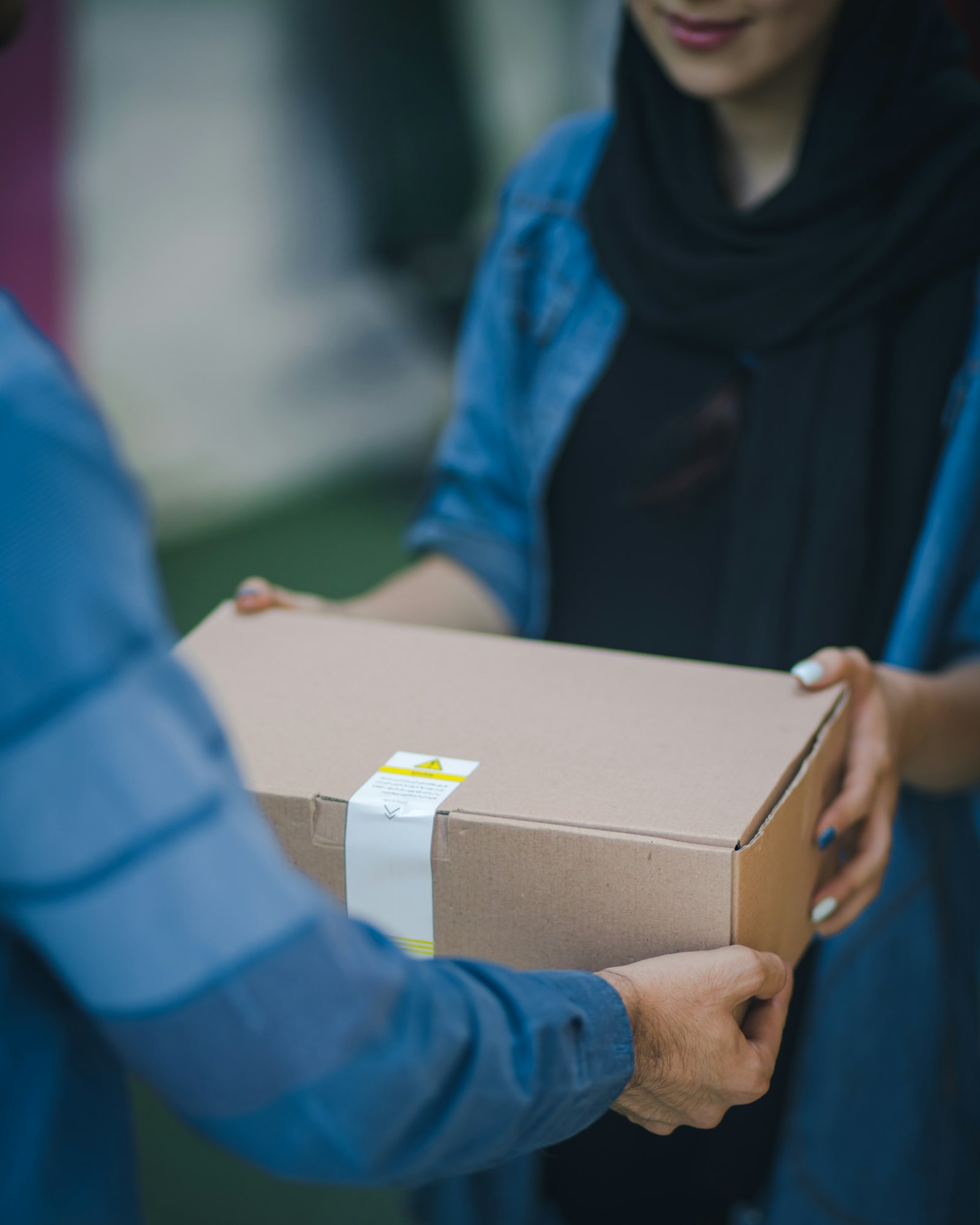 Customer receiving a parcel at the door